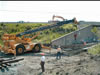 IES Equipment and Work Crews Assissting Railroad Personnel Install a New Section of Rail